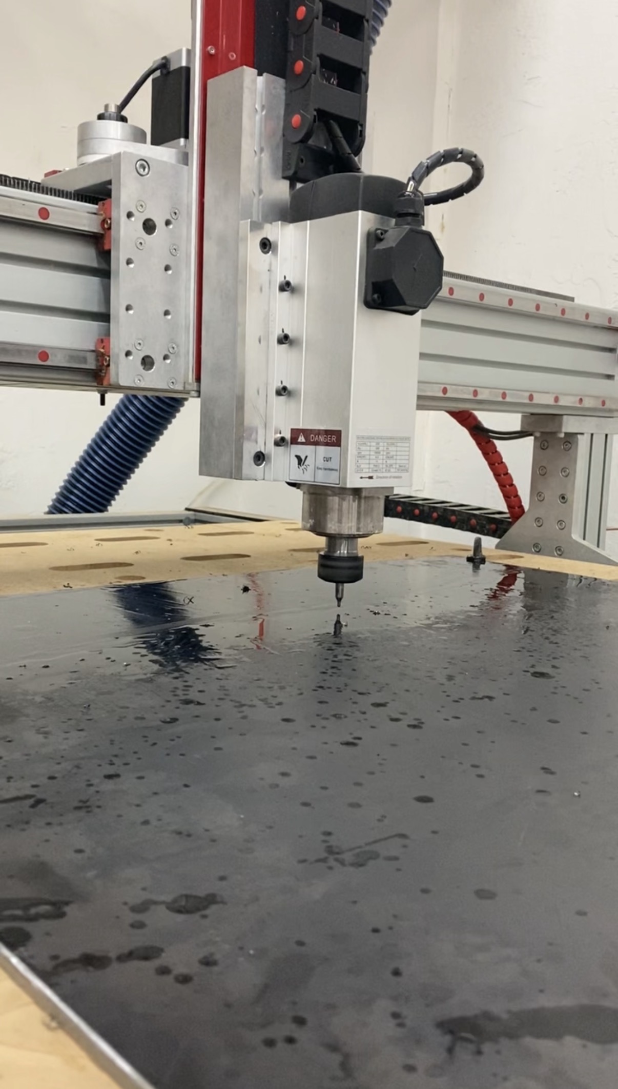 Center drilling the surface with a CNC router